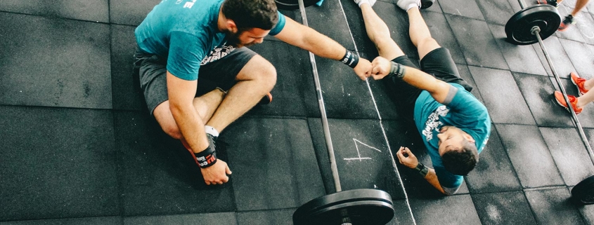 Photo of two men with weights